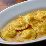 Ravioli stuffed with white fish and scallops, chickpea and shrimp sauce