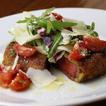 Beef fillet cutlet with parmesan and fresh tomato