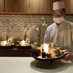 銀座 しのはら - 祝い八寸：セリと雉のお浸し、鰤の藁焼き燻し、なまこの茶ぶりの霙酢、干し数の子、玉子真丈、松風、梅人参、のし梅の結び型、黒豆、せんまい漬け、蛸の炊いたん、スモークサーモンの黄身酢がけ、鰆の西京焼き、叩き牛蒡
