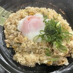 Egg fried rice topped with warm egg
