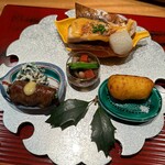おおたに - 八寸〜鰤と丸大根の柚子味噌焼き　五目豆　菜の花牛肉巻き　インカの目覚め揚げまんじゅう　ちぢみほうれん草の白和え