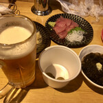 羽田市場食堂 - ビール（発泡酒）はメダル1枚で、自動サーバーです。