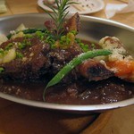 イルゴローソ - 骨付牛バラ肉の赤ワイン煮込み　温野菜添え