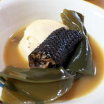 カナ - 黒々とした皮は、うなぎの皮のような食感