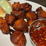 ネパール民族料理 アーガン - 豚肉のスパイス焼き「ポークセクワ」(Pork Sekuwa)