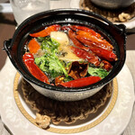 中国四川酒家 蔓山 - スズキの四川オイル煮。山椒のしびれ旨みが、オイルから野菜や魚に移る