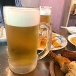 墨国回転鶏料理 - 生ビール(カールスバーグ)