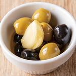 Two types of olives soaked in oil