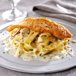 Creamy pasta with truffle-scented grilled salmon