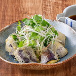 Fried eggplant topped with aromatic vegetables