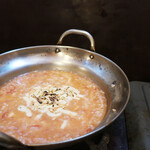漢方和牛とかき小屋　四喜 - ガンガン焼きで出た出汁で作るトマトチーズリゾット