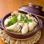 Oyster rice in clay pot