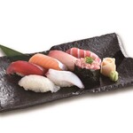 Seven pieces of nigiri with medium-fatty pieces