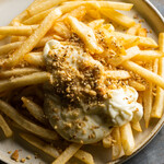 French fries with cheese dip and dukkah spice