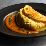 Mont Saint Michel style soufflé omelet with tomato coulis and arugula sauce