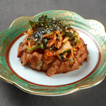 Fish cake topped with Chinese cabbage and kimchi