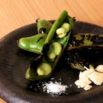 Charcoal-grilled fava beans and parmesan