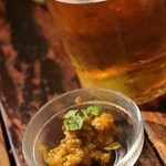 スパイスカフェ - ビールのお通し(チキンの酢漬け)