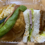 ケーワン - タマゴとハムと野菜が挟まれたバターロールサンド、ハムサンド、カツサンドが入って満足度が高いです