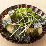 Fried rice cakes covered in seaweed