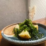 New potatoes topped with green seaweed butter