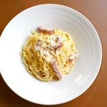 Rich carbonara with fresh cream and pepper