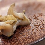 肴屋 魚まる - つぶ貝のガーリックオイル炒め