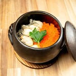 Oyster rice in clay pot