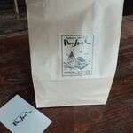 ドーシェル - 「ドーシェル」のデザイン入りの袋