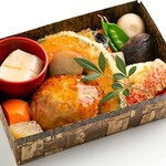 Seasonal Bento (boxed lunch) of golden meatballs with ponzu sauce