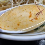 ラーメン もっけだの - 2023.7限定『冷し豆乳担々麺(食べるラー油つける)+C賞特典ネギ』のスープ