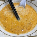 ラーメン もっけだの - 2023.7限定『冷し豆乳担々麺(食べるラー油つける)+C賞特典ネギ』のスープ