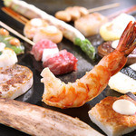源氏本店 - 本店限定の鉄板串焼きです。具材が大きいのが特徴です。