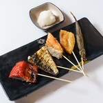 Assortment of 5 grilled fish skewers