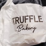 トリュフミニ - 白トリュフの塩パンが入っている紙袋