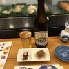 Sakae Zushi - 瓶ビール.サッポロクラッシック、お通し：タコの柔らか煮と、イカの醤油漬け