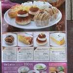 ポポラマーマ - 店の外のポスターのケーキの説明。
