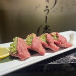 Yakiniku Ushishi - 当店人気メニューの「ネギ包みタン」です！