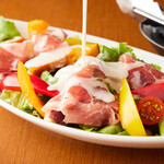 Caesar salad with Prosciutto and colorful vegetables