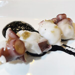 Octopus Grilled skewer with squid ink and anchovy sauce