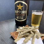 212732309 - 骨せんべいと瓶ビール