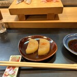 寿し辰 - 牛すじ煮の出汁で煮た大根。