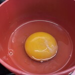 ラーメン もっけだの - 『朝食セット(ラーメン)+あぶら飯』の『生卵』