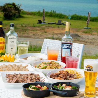 Enjoy a blissful Barbecue under a clear blue sky while looking out at the ocean.