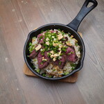 Teppanyaki garlic rice topped with beef skirt steak