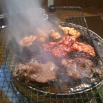 Kotobuki - 煙がもくもくと上がる炭火焼きです。