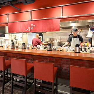 The restaurant has an authentic Chinese atmosphere. The counter seats are great for a lively atmosphere.