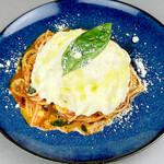 Spaghetti with melty mozzarella cheese and basil tomato sauce