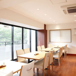 An open interior with a view of the Sumida River