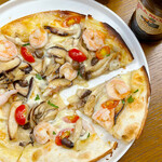Pizza with shrimp, 4 types of mushrooms, and cherry tomatoes